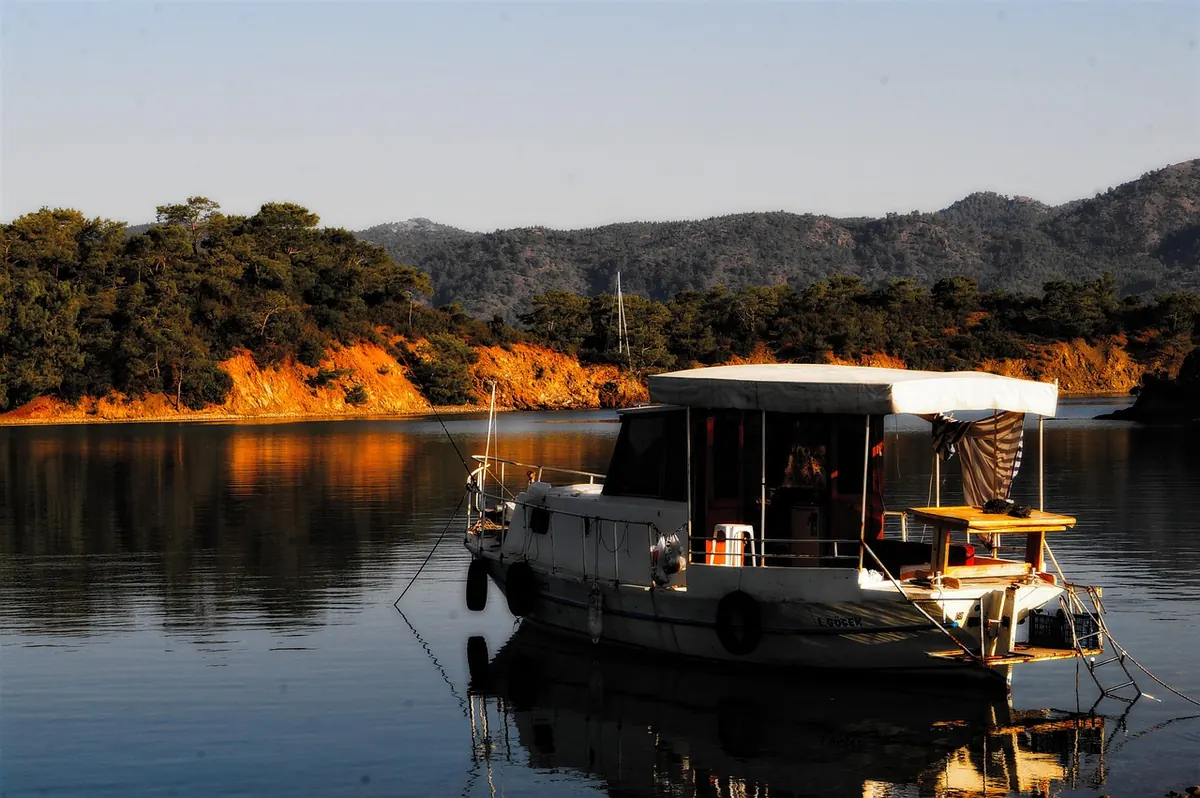A boat moored in a quiet bay near Göcek
