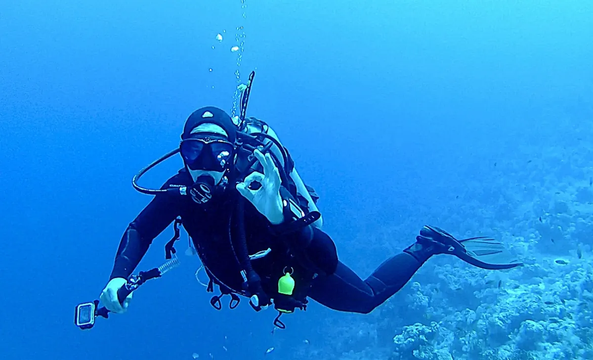 A scuba diver in clear blue water