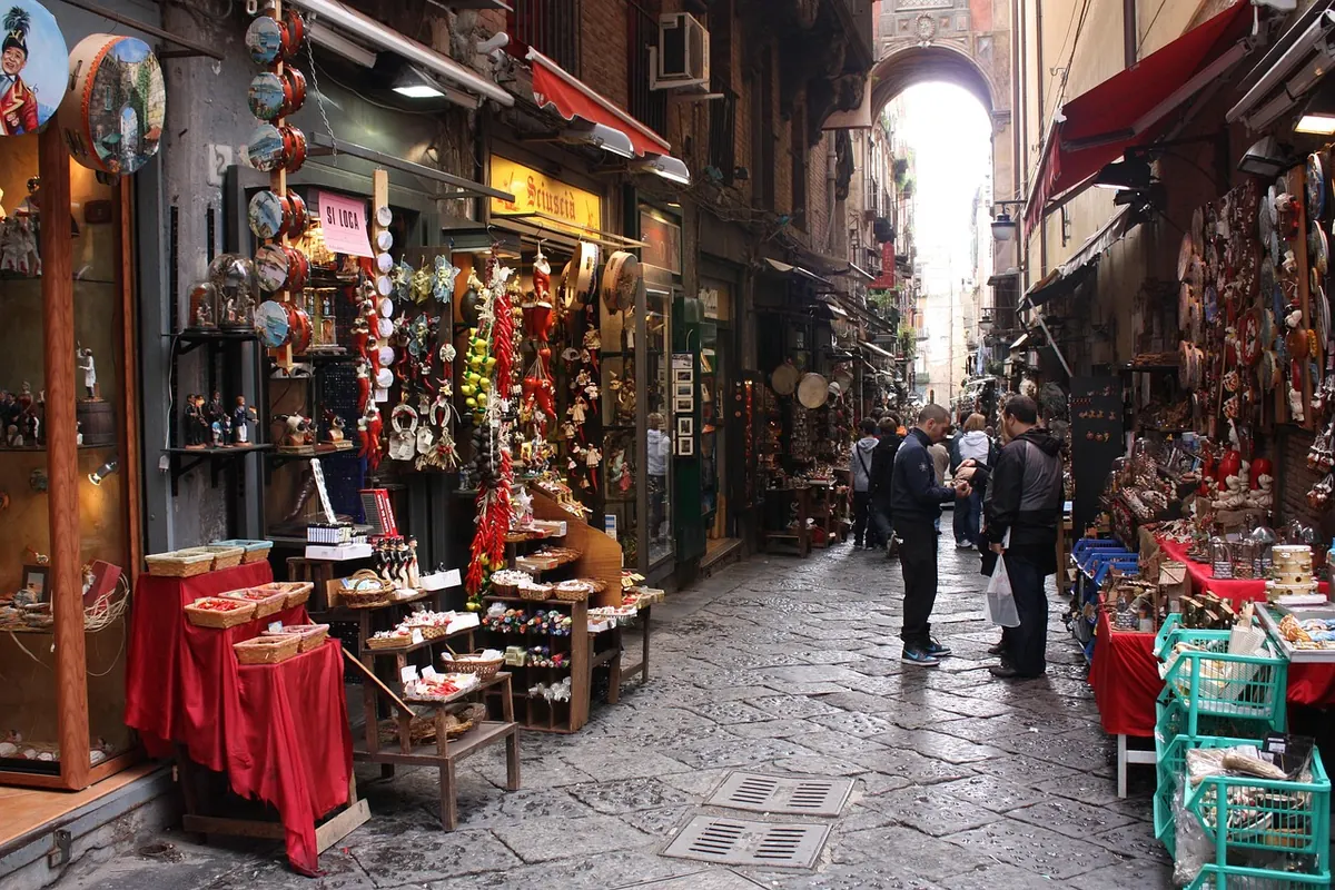 A narrow street of shops in old Naples