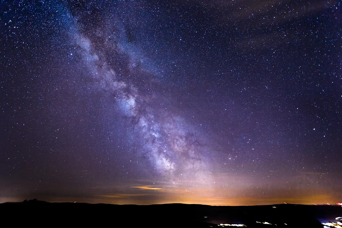 Stars over a mountain landscape
