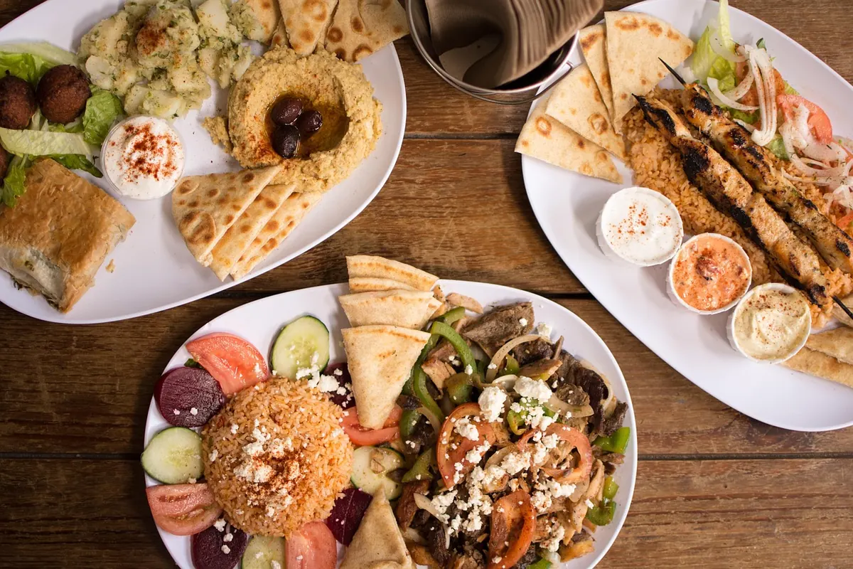 Greek souvlaki skewers with pita and salads