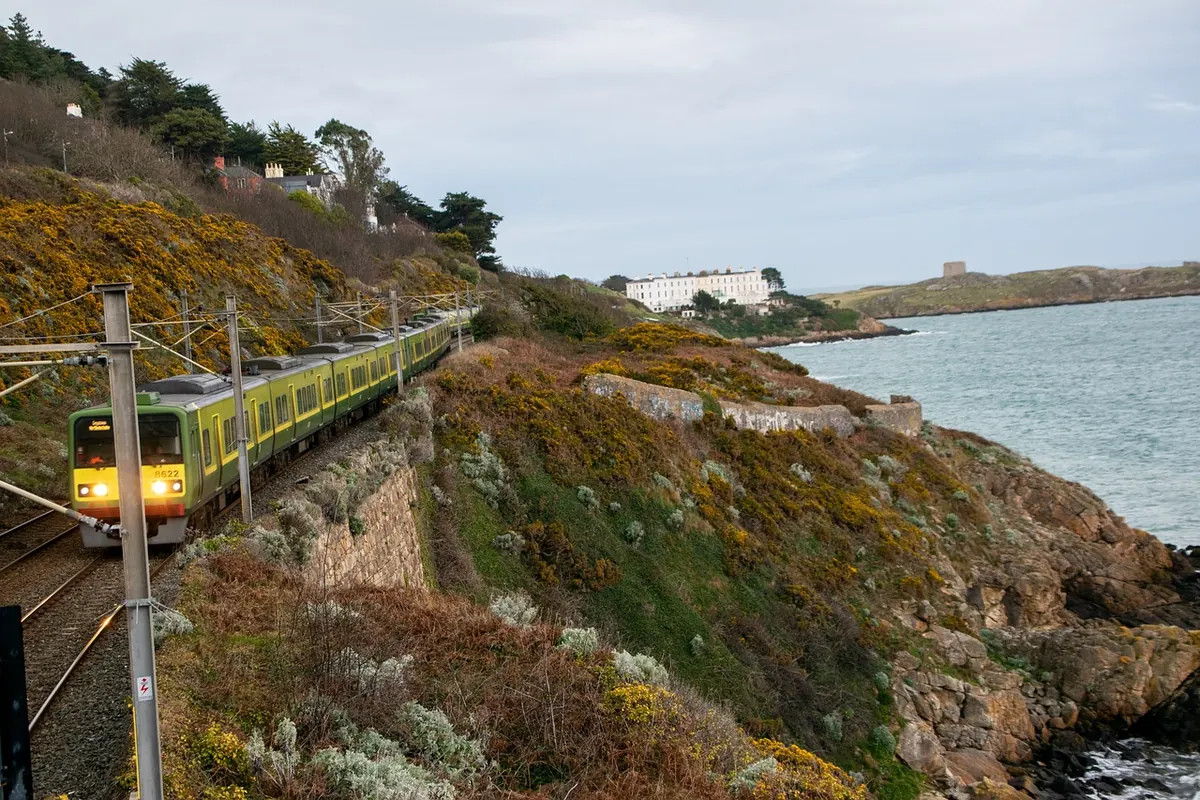 A DART train running along the coast near Dublin