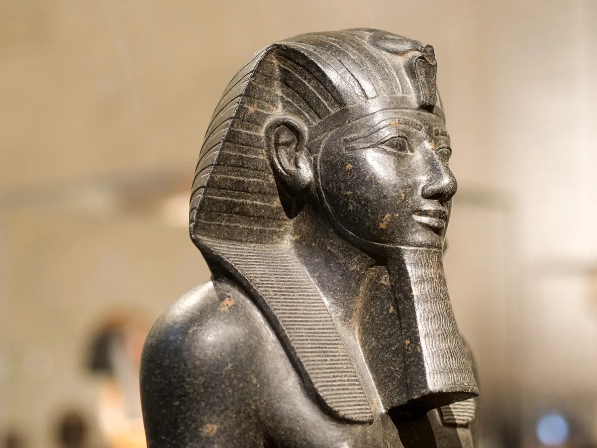 A granite statue of an Egyptian pharaoh