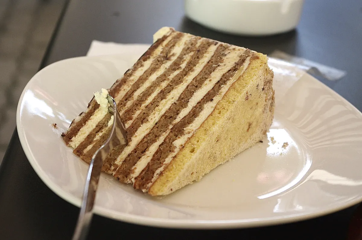 A slice of Esterhazy Torte with its feathered icing