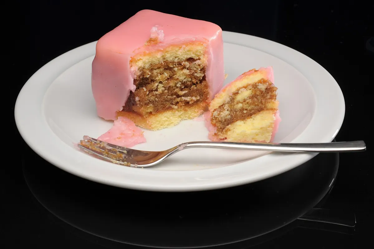 A Punschkrapfen cut open to show its layers