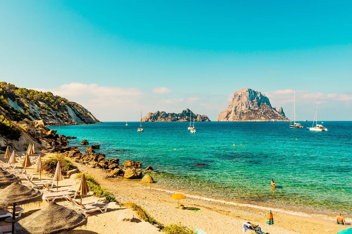 A turquoise Ibiza beach facing Es Vedrà
