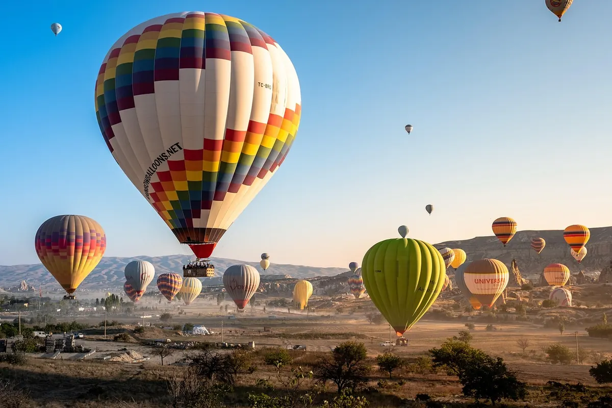 Hot-air balloons over Cappadocia at sunrise