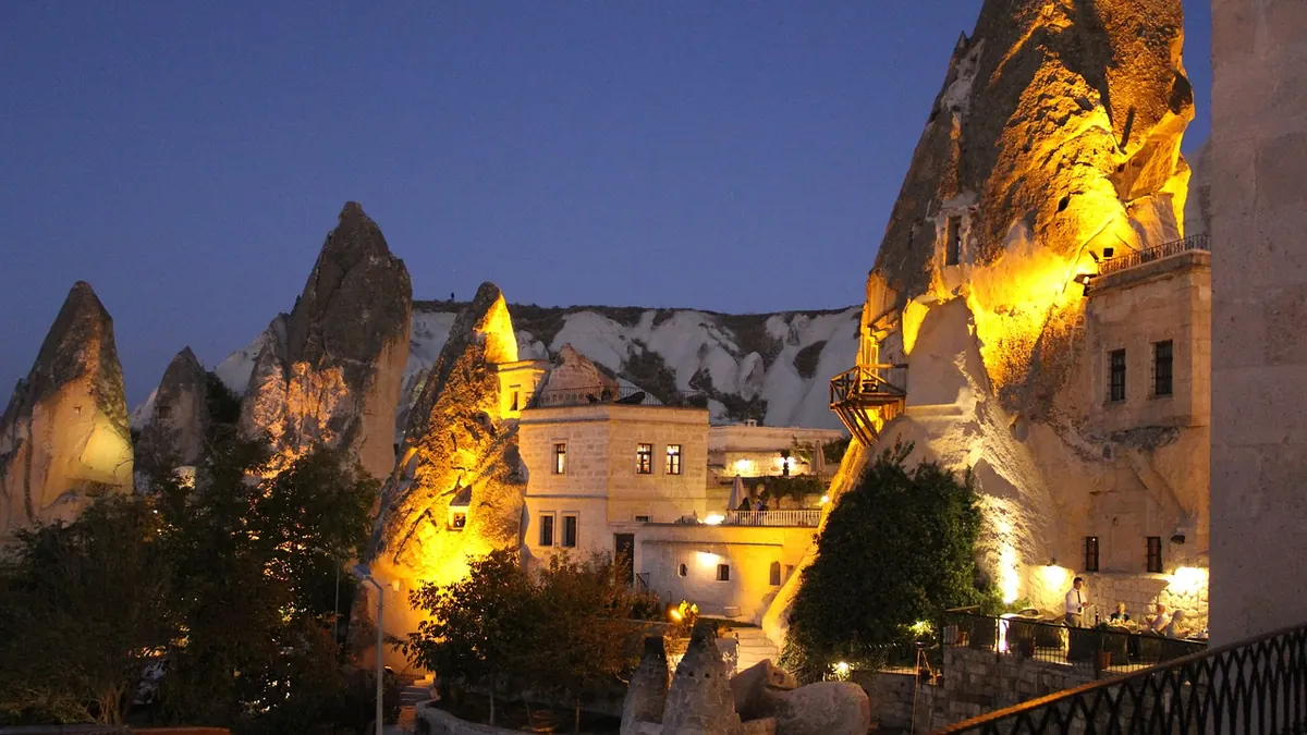 Cave houses lit up at night in Cappadocia