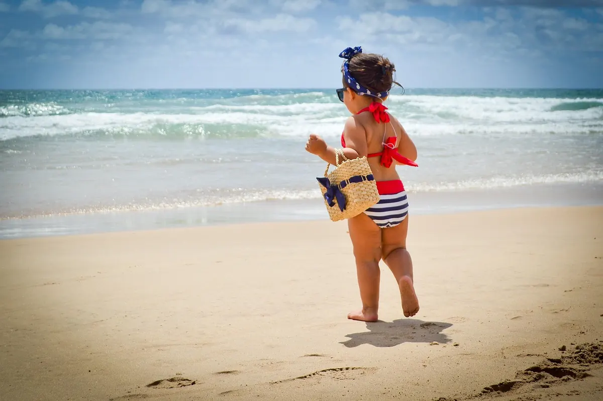 A child playing on the beach