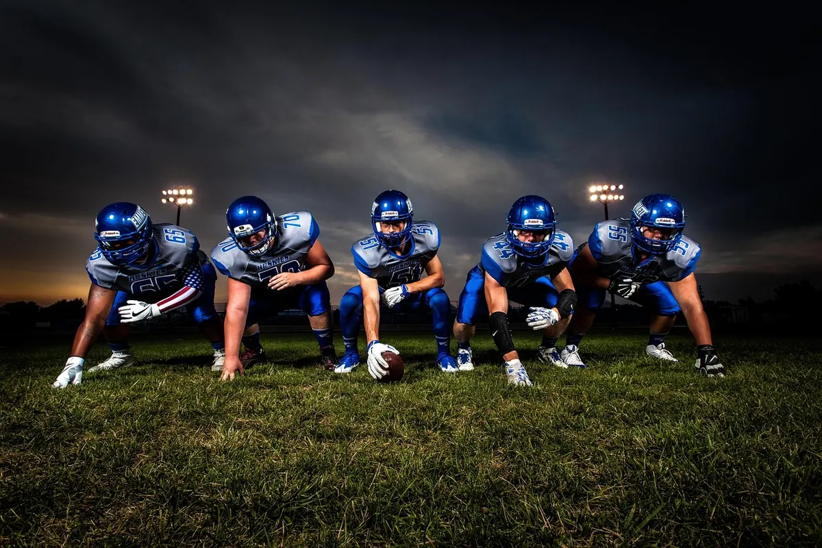 American football players lined up before a play