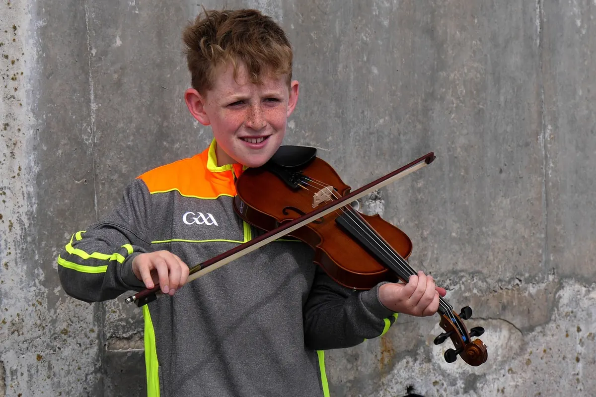 A young street musician in Ireland