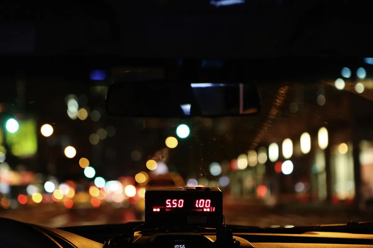 A taxi meter at night
