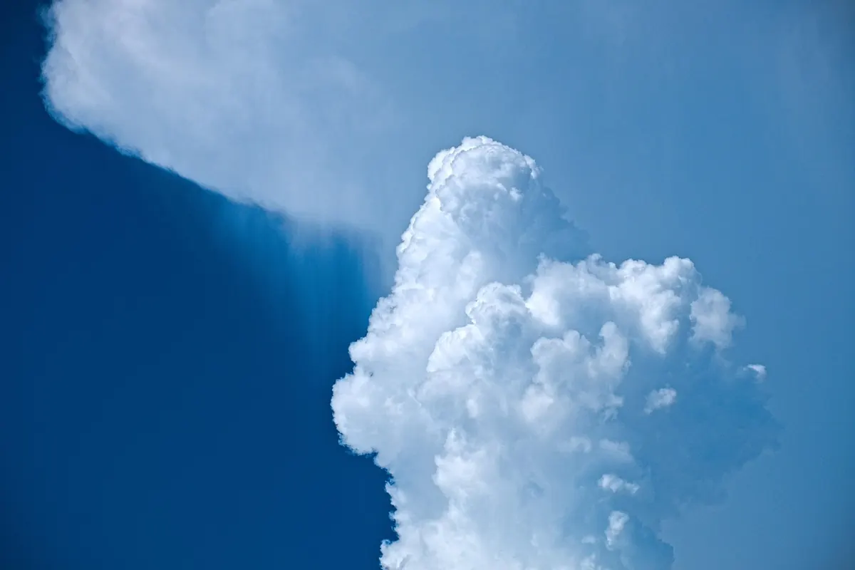 A towering cumulus cloud growing into a storm