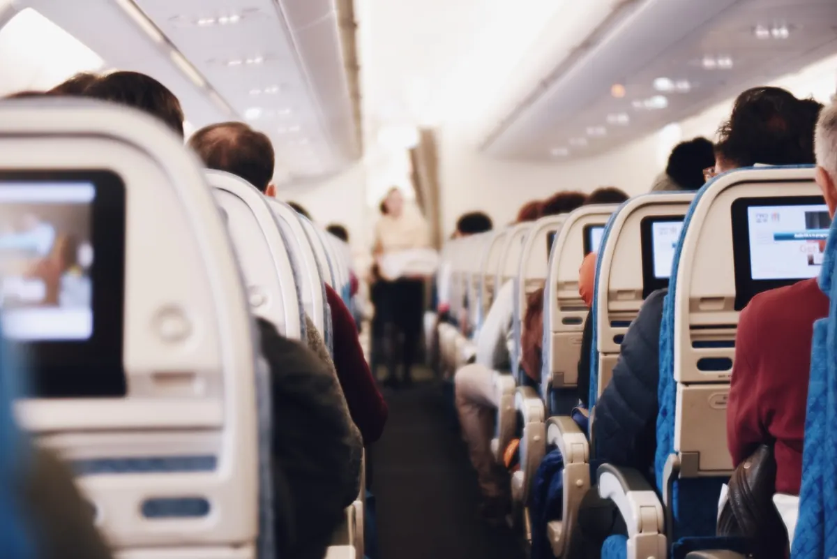 Passengers seated in an airliner cabin