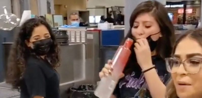 Women give free alcohol shots to passengers at security so it won’t go to waste