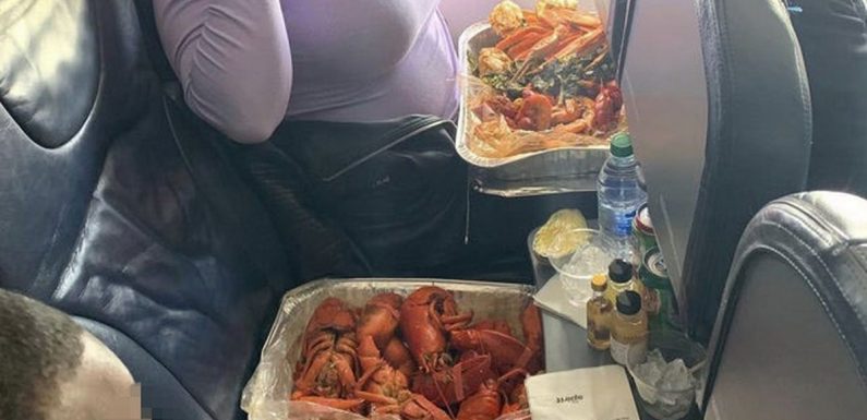 Flight attendants gobsmacked as woman eats huge tray of lobsters on plane