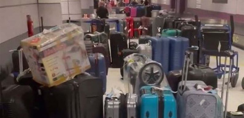 ‘Abandoned’ suitcases line Manchester Airport as families told to leave luggage