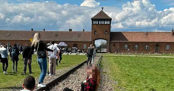 Auschwitz urges visitors to ‘respect the dead’ after woman’s ‘offensive’ photo