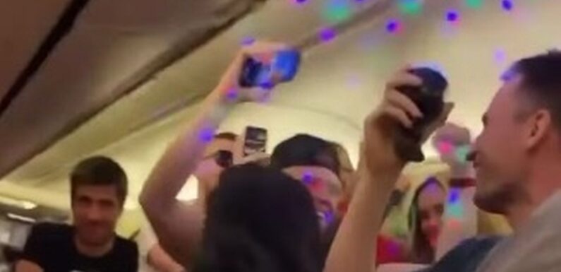 Rowdy holidaymakers hold mini rave with disco lights on Ryanair flight to Ibiza