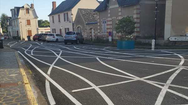 The French village with SQUIGGLES painted on roads to stop speeding