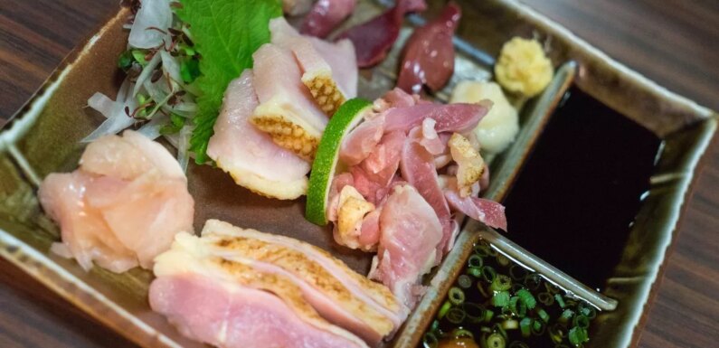 People horrified as man eats raw chicken dish on holiday – and says he likes it